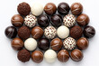 Chocolate candy balls on white background.