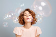 © Magryt - Beautiful young woman surrounded by soap bubbles. Concept of dreaming, thinking, worries and problems, lightheartedness. Mental health, psychology, inner world, shyness, alone