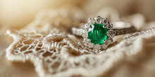 Emerald Ring On A Vintage Lace Cushion, Diamond Accents, Soft-focus Background
