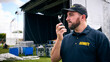 © Monkey Business - Security Team At Outdoor Stage For Music Festival Or Concert Talking Into Radio