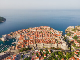 Wall Mural - Aerial establishing shot of old town of Dubrovnik, Dalmatia, Croatia. Medieval city fortress on the coast of Adriatic sea. Drone view. Travel destination