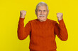 © Andrii Iemelianenko - Happy joyful senior man celebrating success victory, winning, birthday, lottery jackpot, goal achievement play game good positive news, triumph. Old mature grandfather isolated on yellow background