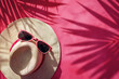 Leinwandbild Motiv top view of hat sunglasses and a tropical landscape           