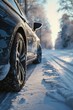 A car parked on a snowy road. Suitable for winter scenes and transportation themes