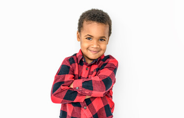 Cute happy 3 year old American boy smiling for the camera with carrot vest