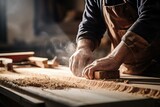 Fototapeta  - Close-up of a woodworker's hands sanding a piece of wood, with dust particles in the air