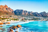 Fototapeta Miasta - Cape Town Sunset over Camps Bay Beach with Table Mountain and Twelve Apostles in the Background