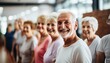 © Crowded Studio - Ancianos haciendo ejercicios de estiramiento juntos en un centro de jubilados. Ancianos y ancianas haciendo ejercicio en una residencia de ancianos durante el ejercicio diario.