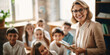 © Andrii Zastrozhnov - A cheerful teacher guides happy children in an educational classroom, fostering positive learning experiences together.