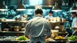 © Kanisorn - chef working in a busy restaurant kitchen