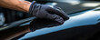 © Daniela - A man cleaning or polish luxury car with microfiber cloth, Car clean concept.