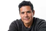 Fototapeta  - Casual and comfortable portrait of a Latino man, easy-going and natural, white background