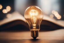 Light Bulb Glowing On Book Idea Of Inspiration From Reading Innovation Idea Concept Self-learning