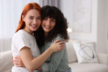 Canvas Print - Portrait of happy young friends at home, space for text