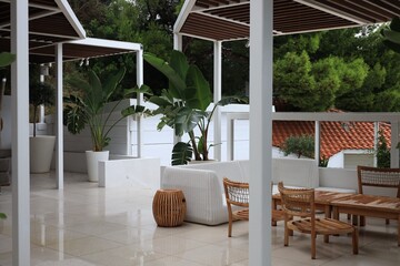 Canvas Print - Terrace with outdoor furniture and green plants