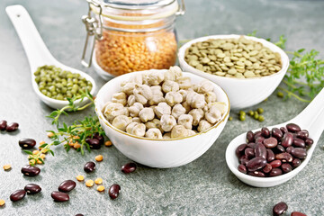 Poster - Legumes in bowls and spoons on granite table