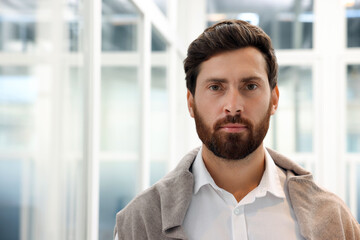 Poster - Portrait of attractive man on blurred background, space for text