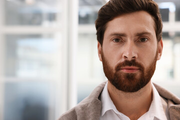 Poster - Portrait of attractive man on blurred background, space for text