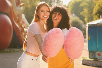 Wall Mural - Happy friends with cotton candies outdoors on sunny day