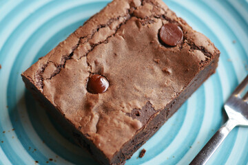 slice of brownie on plate on table 