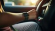 Closeup of a teenage hand adjusting a seatbelt in a car.