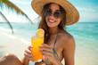 © Kien - beautiful girl in bikini holding a juice glass, enjoying her vacation at the beach