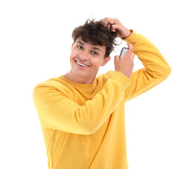 Sticker - Handsome young man applying hair spray on his curly hair against white background