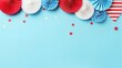 © Ahmad-Muslimin - 4th of July American Independence Day decorations on pastel blue background. Flat lay, top view, copy space