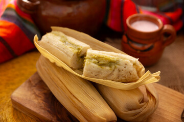 Wall Mural - Tamales. hispanic dish typical of Mexico and some Latin American countries. Corn dough wrapped in corn leaves. The tamales are steamed.