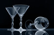 Three empty wine glasses isolated on black background