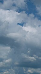 Wall Mural - Blue sky with fluffy cloud time lapse on a sunny day 4k footage.