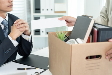 resignation, leave, quit, Stressful businesswomen will resign from the company. Female staff is lifting a brown paper box that holds personal items. , job placement and vacancies, resignation letter