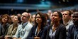 © Amonthep - Diverse men and women attending a conference in a convention center.Business people applauding for public speaker during seminar