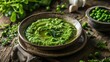  a bowl of pea and pea soup on a wooden table next to a bowl of peas and pea sprouts.