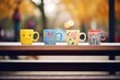 colorful mugs of hot beverage on bench