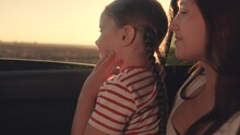 Little Girl Her Mother Look Out Car Window. Happy Family. Mother Daughter Child Girl Kid Back Seat Car. Family Trip Summer By Car. Family Travel Dream. Chidhood Dream. Woman Kid Smiling Out Car Window