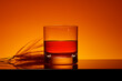 An artistically rendered depiction of a minimalist prairie fire shot, featuring a layered combination of tequila and hot sauce in a clear shot glass.