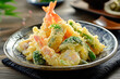 A golden Japanese tempura, featuring an assortment of local vegetables and seafood