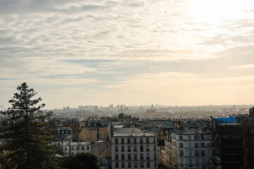 Wall Mural - Paris panorama skyline photo. Silhouettes of Paris landmark architecture building during a sunny winter day, view from Montmartre hill.