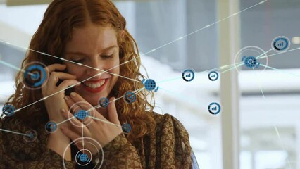 Sticker - Animation of network of connections over caucasian woman talking on smartphone