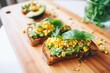 avocado toast with grilled corn kernels and cilantro leaves
