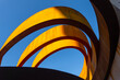 © Anton Gvozdikov - Abstract view of a modern sculptural architecture with vibrant red and yellow curves.