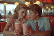 Cute couple drinking shake in american diner of 1950s years, vintage style
