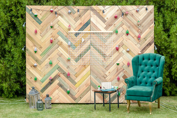 Beautiful display wall for a wedding featuring a chevron pattern made with reclaimed wood as a wonderful photo backdrop. Rustic chevron wedding backdrop made from reclaimed wood.