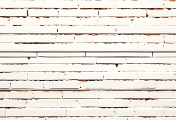 White brick sidewalk background. Neutral texture of a flat brick wall close-up.