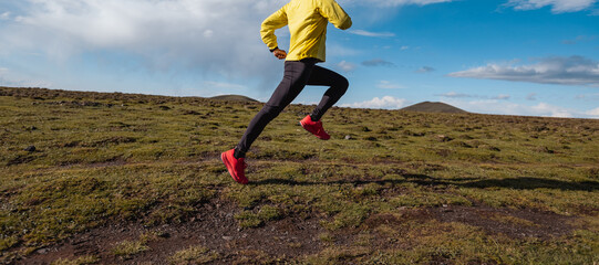 Wall Mural - Woman trail runner cross country running to high altitude mountain peak