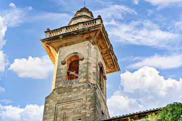 Wall Mural - View of the bell tower of the San Bartolome church at dusk, from the picturesque village of Valldemosa, Mallorca, Balearic Islands, Spain