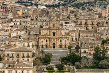 Cityscape with the Duomo di San Giorgio (Cathedral of St George), a Baroque church in Modica, Ragusa, Sicily, Italy. 