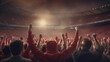 © Onchira - football Fans in red shirt show hands celebration on big stadium during football game