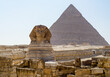 Sphinx statue and Cheops pyramid in Giza Egypt